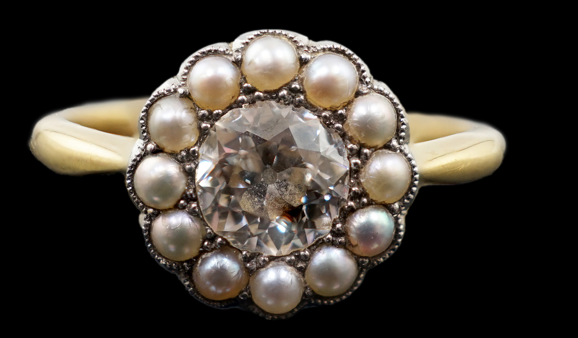 An early 20th century 18ct gold, diamond and millegrain set seed pearl circular cluster ring